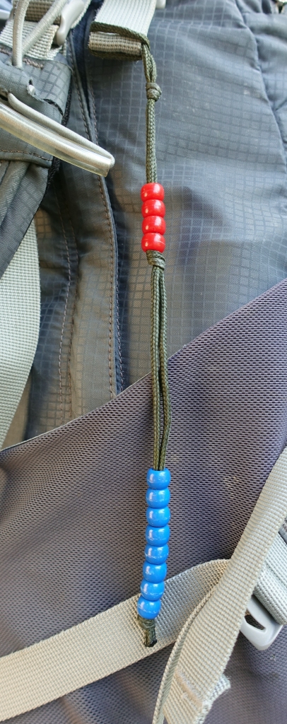 Pacer beads hang from the pack