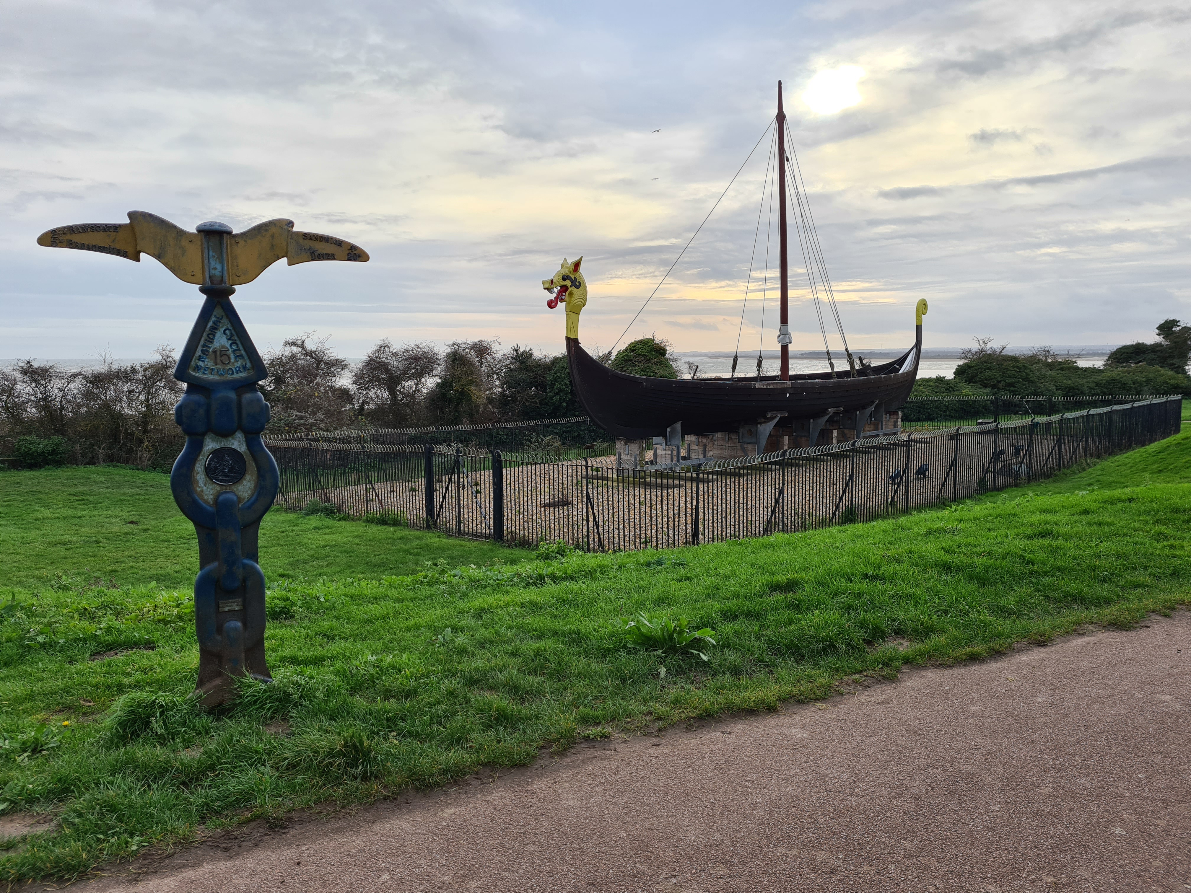 Sustrans Millennium Milepost beside the Hugin- a replica Viking longship sailed from Denmark to Viking Bay, Broadstairs